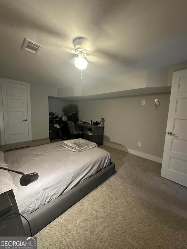 carpeted bedroom featuring ceiling fan