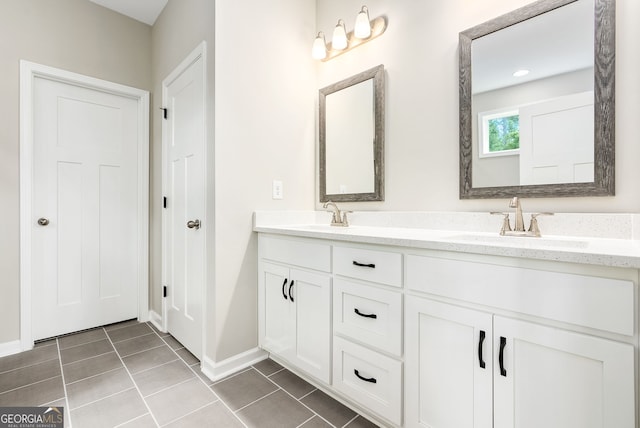 bathroom with tile patterned floors and vanity