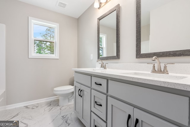 bathroom with vanity and toilet