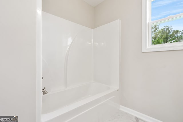 bathroom with shower / washtub combination