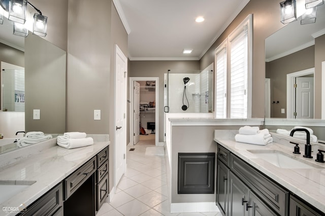 bathroom featuring a shower with door, vanity, crown molding, and tile patterned flooring