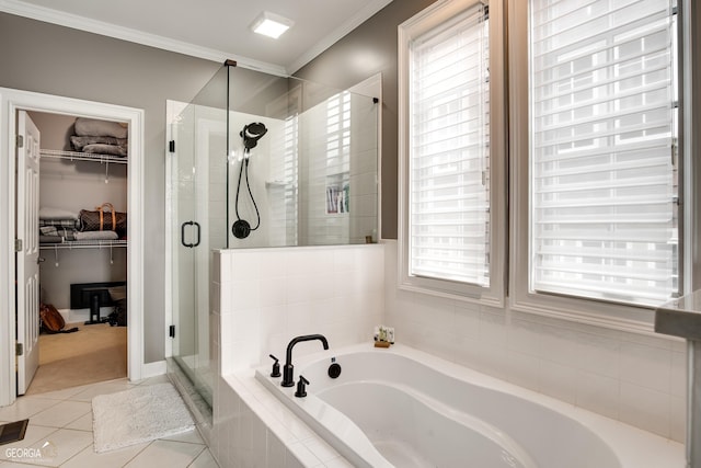 bathroom with ornamental molding, tile patterned floors, and shower with separate bathtub