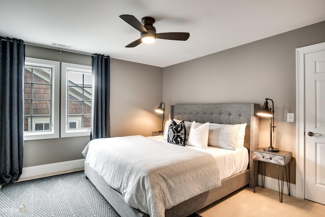 carpeted bedroom with ceiling fan