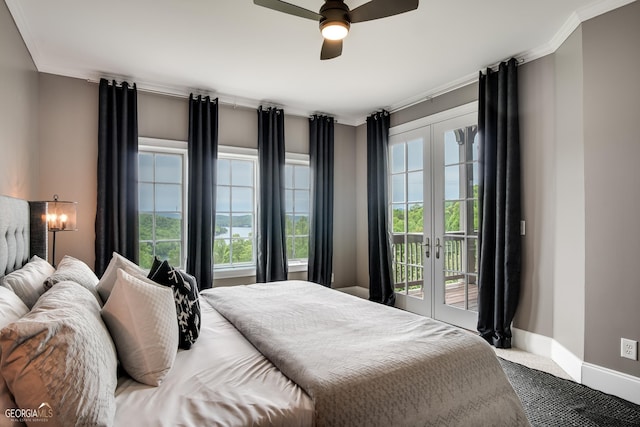 carpeted bedroom with access to exterior, french doors, ceiling fan, and multiple windows