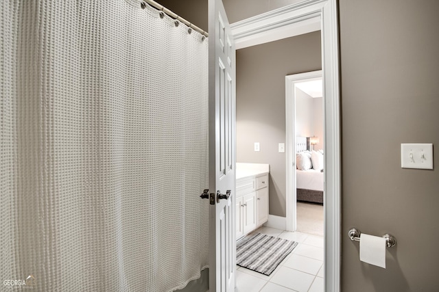 bathroom with vanity and tile patterned flooring