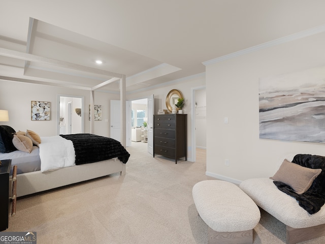 bedroom featuring crown molding, ensuite bath, and light colored carpet