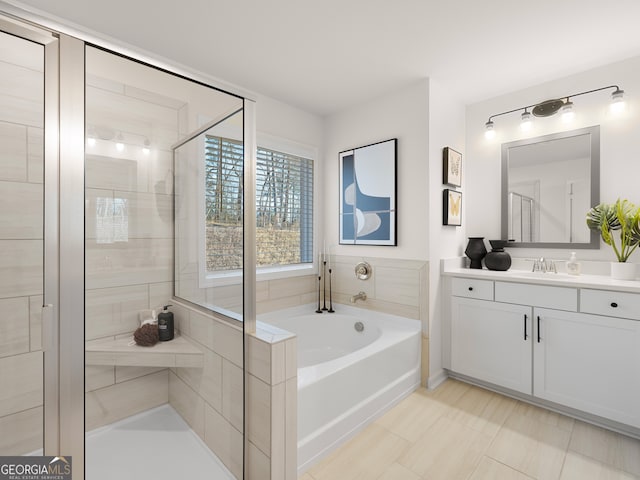 bathroom featuring tile patterned floors, vanity, and shower with separate bathtub