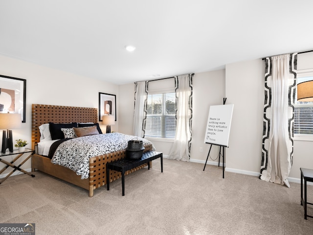 bedroom featuring light carpet