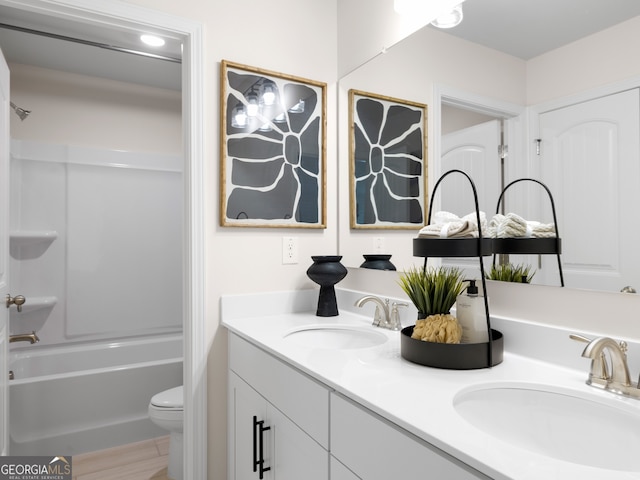 full bathroom featuring vanity, shower / bathing tub combination, and toilet