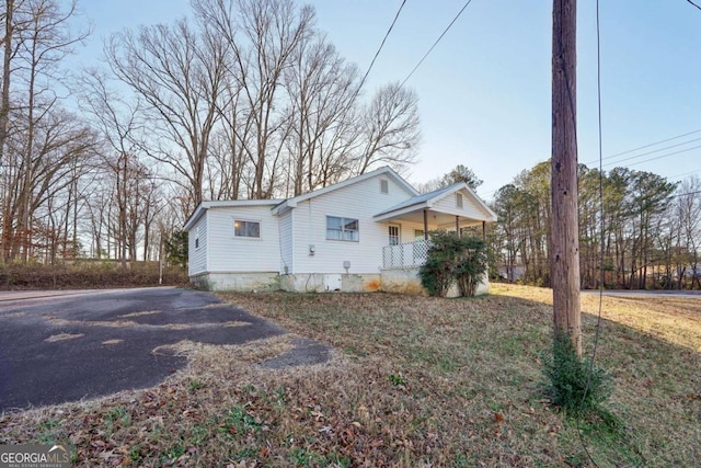 view of home's exterior featuring covered porch