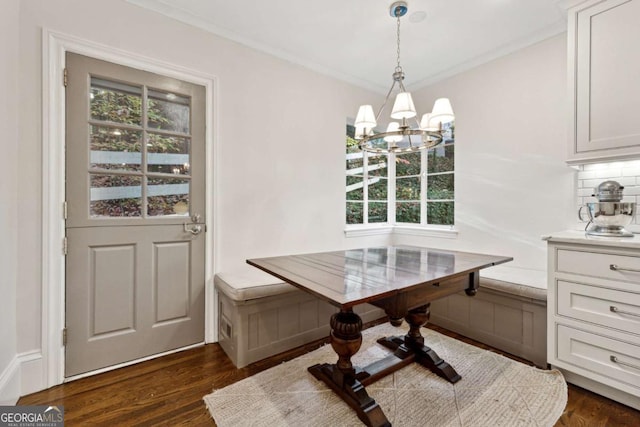 dining room with breakfast area, a wealth of natural light, and dark wood-type flooring