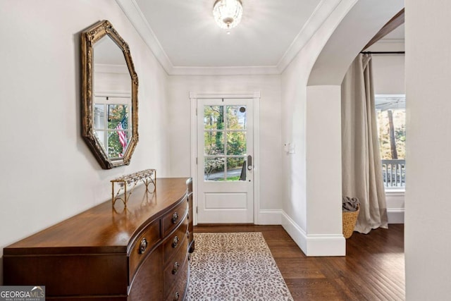 foyer entrance with dark hardwood / wood-style flooring and ornamental molding