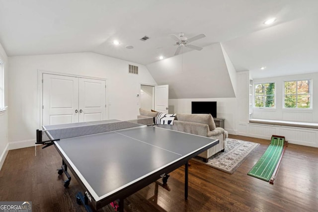 game room with vaulted ceiling, ceiling fan, and dark hardwood / wood-style flooring