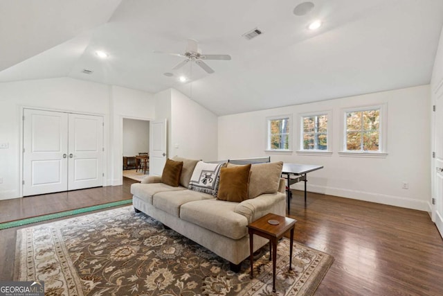 living room with ceiling fan, lofted ceiling, and dark hardwood / wood-style floors