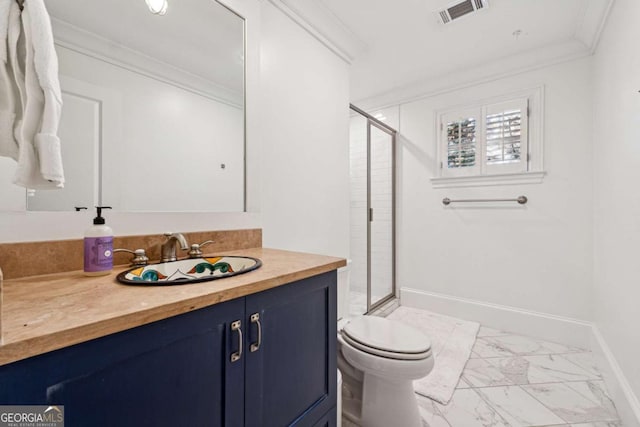 bathroom with crown molding, vanity, toilet, and an enclosed shower