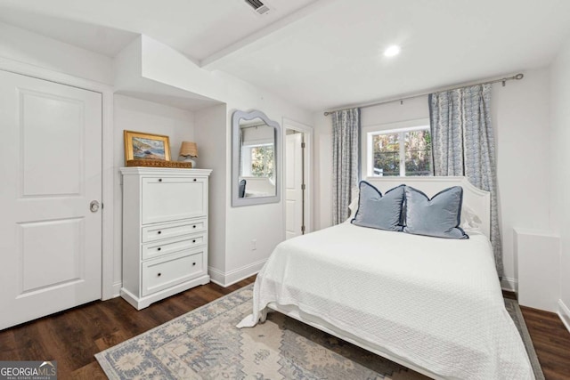 bedroom featuring dark hardwood / wood-style flooring