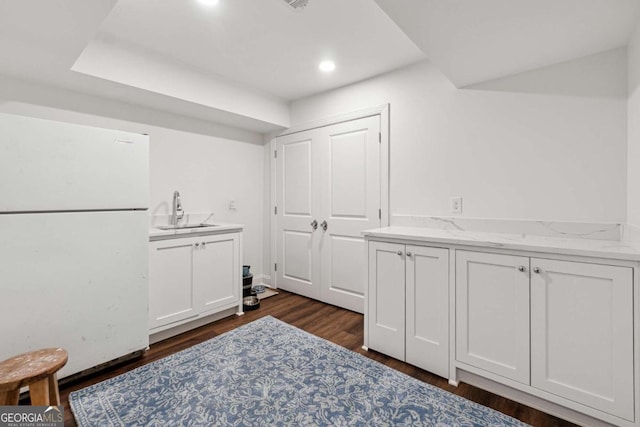 interior space with sink and dark hardwood / wood-style flooring