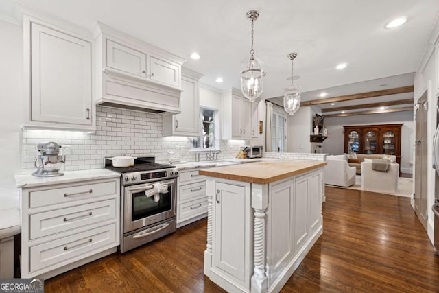 kitchen featuring white cabinets, stainless steel range with gas cooktop, and wooden counters