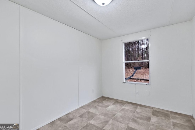 empty room with a textured ceiling