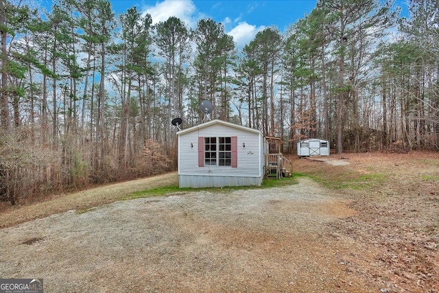 exterior space featuring a storage shed