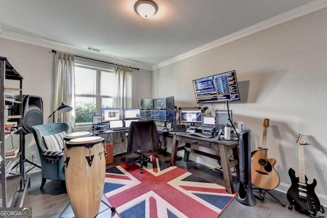 office area featuring hardwood / wood-style floors and crown molding