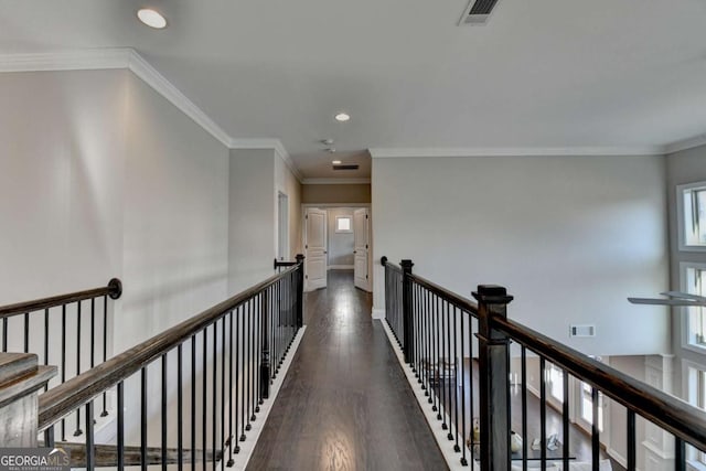 corridor featuring dark hardwood / wood-style flooring and crown molding