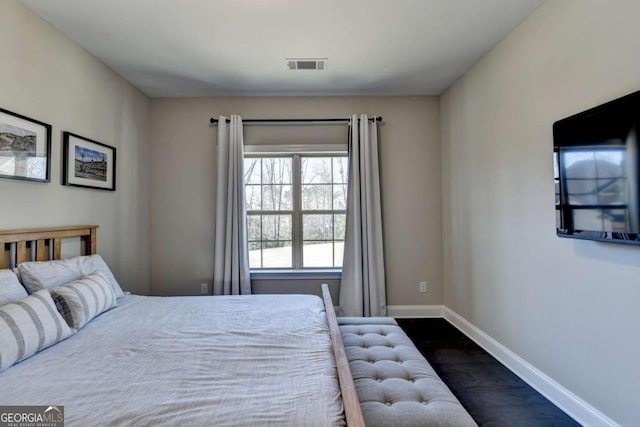 unfurnished bedroom featuring dark hardwood / wood-style flooring