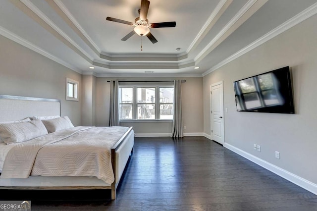 bedroom with ceiling fan, a raised ceiling, crown molding, and multiple windows