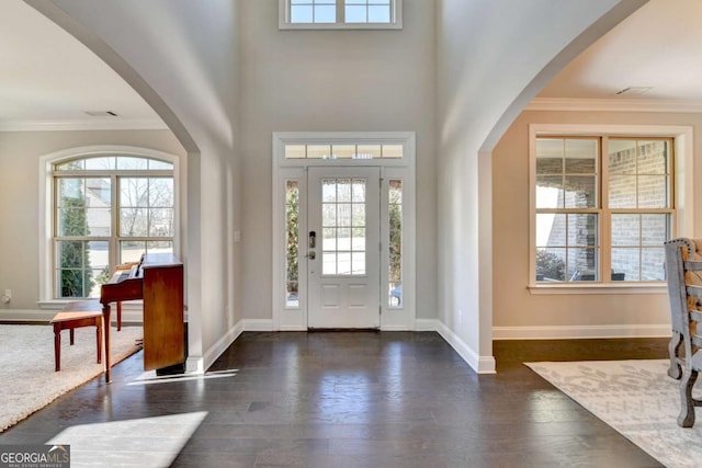 entrance foyer featuring dark hardwood / wood-style floors and ornamental molding