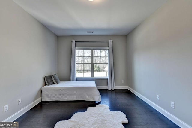 bedroom featuring dark hardwood / wood-style floors