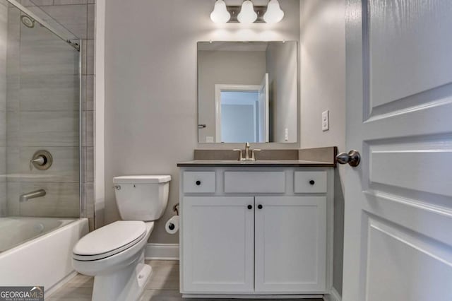 full bathroom with toilet, tiled shower / bath, and vanity