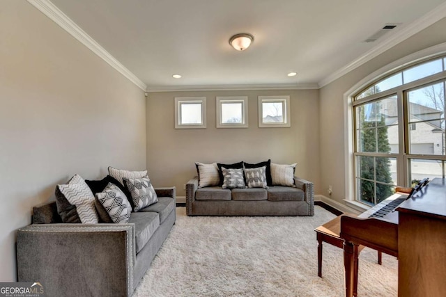 carpeted living room featuring ornamental molding