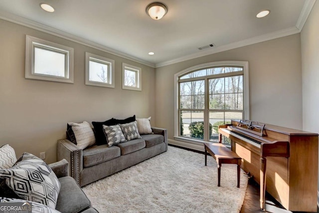 living room featuring crown molding