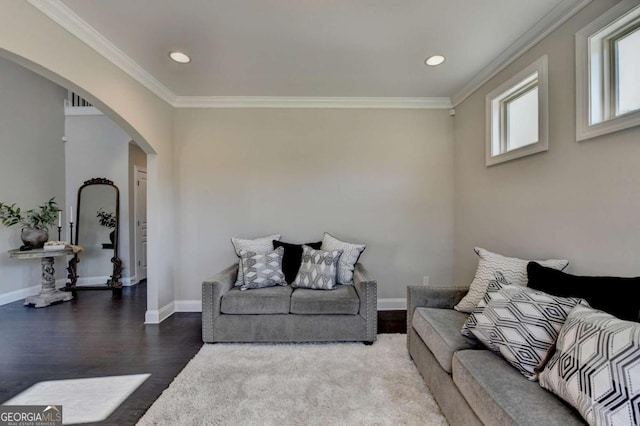 living room featuring hardwood / wood-style floors and crown molding