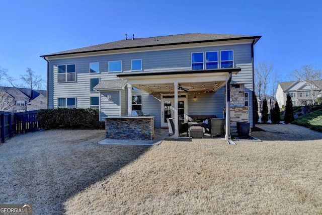 rear view of house with a patio area, an outdoor living space, and ceiling fan