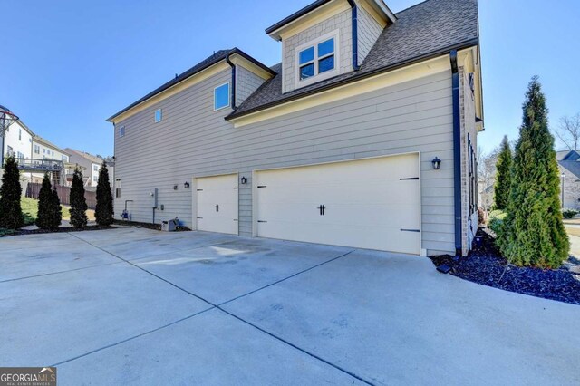 view of side of home with a garage