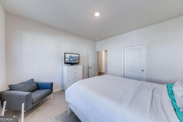 carpeted bedroom with a closet