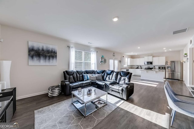 living room featuring dark hardwood / wood-style floors