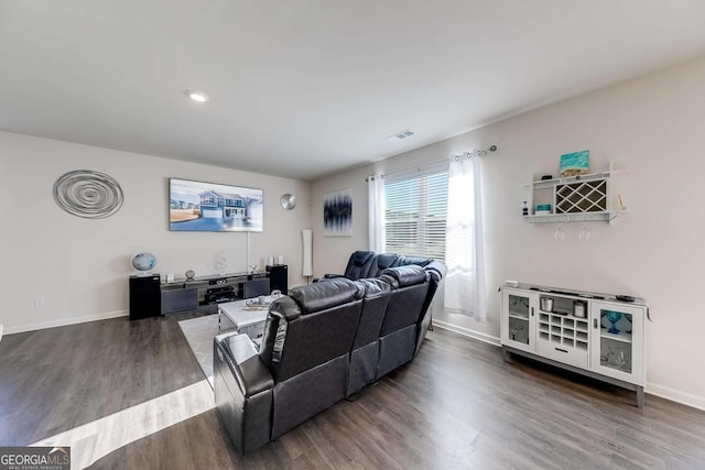 living room with dark hardwood / wood-style floors