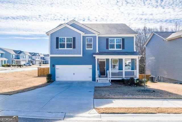 463 Walnut Grove Way, Pendergrass, GA 30567 - view of front facade with covered porch, an attached garage, central AC, and concrete driveway