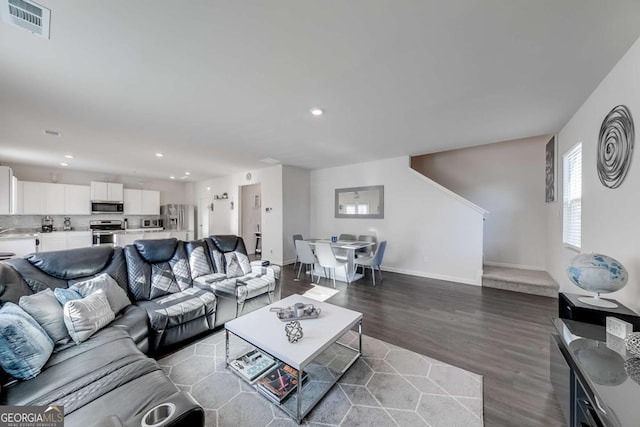 living room featuring dark hardwood / wood-style floors