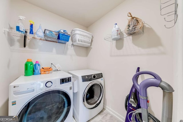 washroom featuring washing machine and dryer