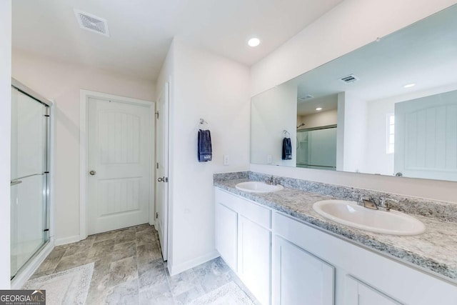 bathroom featuring vanity and walk in shower