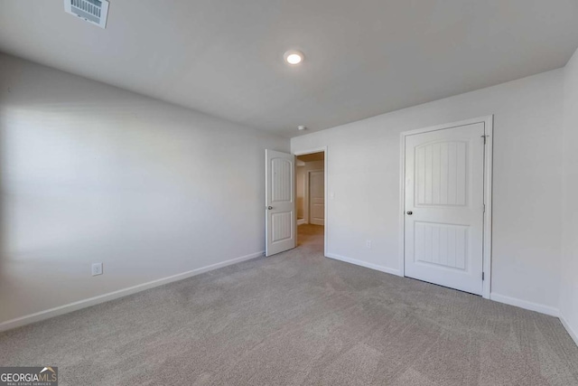 unfurnished bedroom with light colored carpet