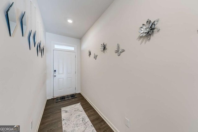 entryway with dark wood-type flooring