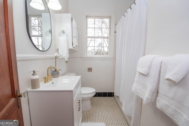 bathroom featuring toilet and vanity