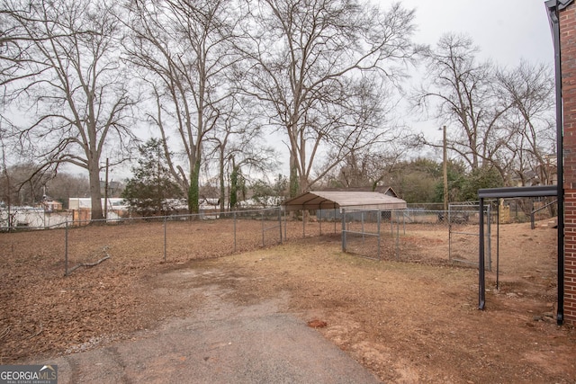 view of yard with a carport