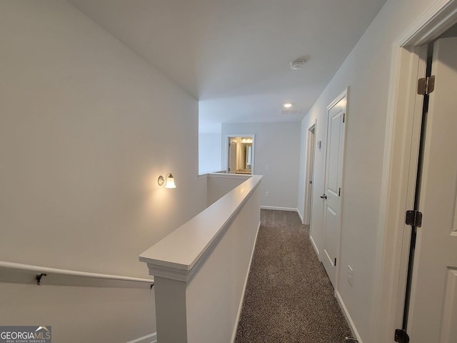 hallway with dark carpet