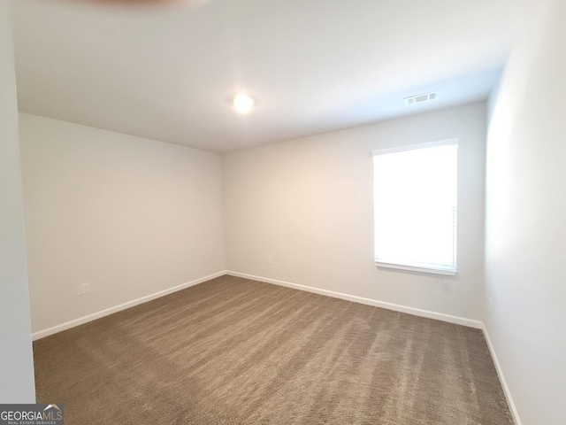 empty room featuring carpet flooring