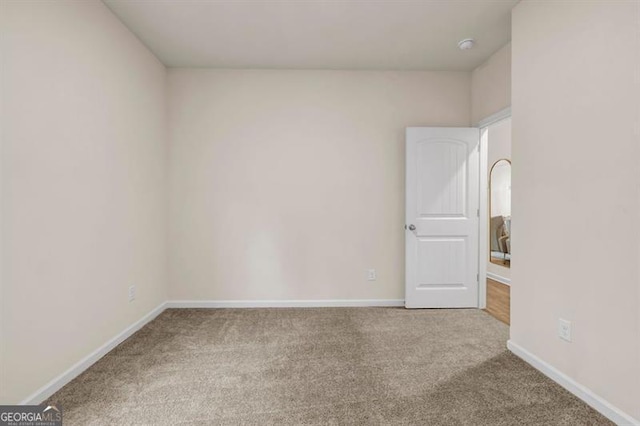 unfurnished room with carpet